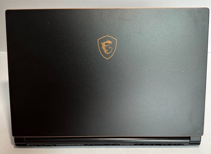 Ігровий ноутбук Б-клас MSI GS65 Stealth Thin 8RF / 15.6" (1920x1080) IPS / Intel Core i7-8750H (6 (12) ядер по 2.2 - 4.1 GHz) / 32 GB DDR4 / 512 GB SSD / nVidia GeForce GTX 1070 Max-Q, 8 GB GDDR5, 256-bit / WebCam / Win 11 Pro б/в - зображення 3