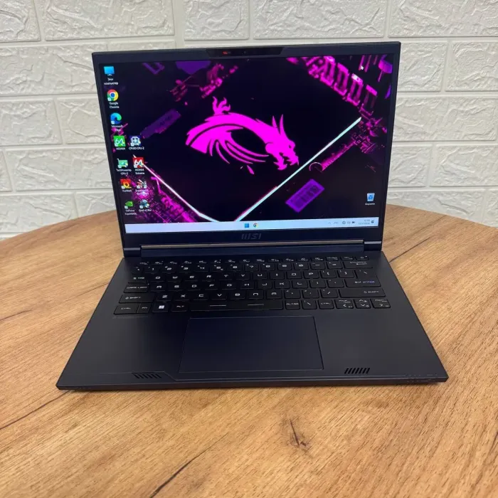 Ігровий ноутбук Б-клас MSI Stealth 14 Studio A13VF / 14" (1920x1200) IPS / Intel Core i7-13620H (10 (16) ядер по 3.6 - 4.9 GHz) / 16 GB DDR5 / 1000 GB SSD / nVidia GeForce RTX 4060, 8 GB GDDR6, 128-bit / WebCam б/в - зображення 2