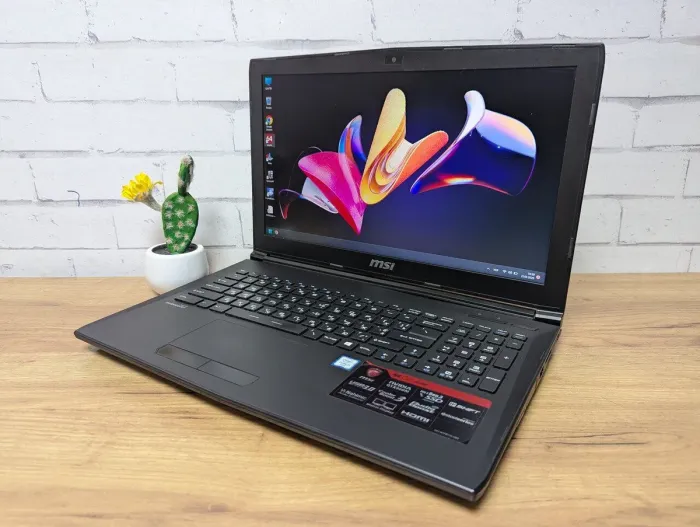 Ігровий ноутбук Б-клас MSI GP62 6QE MS-16J5 / 15.6" (1920x1080) TN / Intel Core i7-6700HQ (4 (8) ядра по 2.6 - 3.5 GHz) / 16 GB DDR4 / 256 GB SSD + 1000 GB HDD / nVidia GeForce GTX 960M, 4 GB GDDR5, 128-bit / WebCam / DVD-ROM б/в - зображення 4