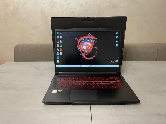 Ігровий ноутбук MSI Thin 15 GF63 10SC-035US / 15,6" (1920x1080) IPS / Intel Core i5-10300H (4 (8) ядра по 2,5 - 4,5 ГГц) / 16 ГБ DDR4 / 256 ГБ SSD M.2 + 500 ГБ HDD / nVidia GeForce GTX 1650 Max-Q, 4 ГБ GDDR5, 128-біт / WebCam б/в - зображення 2