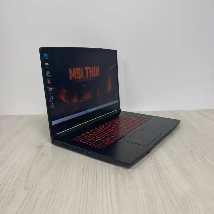 Ігровий ноутбук Б-класу MSI GF63 Thin 11UC / 15.6" (1920x1080) IPS / Intel Core i5-11400H (6 (12) ядер по 2,7 - 4,5 ГГц) / 8 ГБ DDR4 / 512 ГБ SSD NVMe / nVidia GeForce RTX 3050, 4 ГБ GDDR6, 128-bit / WebCam б/в - зображення 4