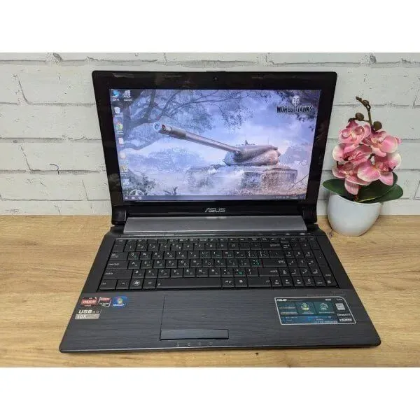Ноутбук Asus N53T / 15.6" (1366x768) TN / AMD A6-3420M (4 ядра по 1.5 - 2.4 GHz) / 8 GB DDR3 / 256 GB SSD / AMD Radeon HD 7610M, 2 GB GDDR3, 128-bit / WebCam / DVD-ROM б/в - зображення 2