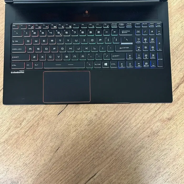 Ігровий ноутбук Б-клас MSI GS63VR Stealth 6RF / 15.6" (1920x1080) IPS / Intel Core i7-6700HQ (4 (8) ядра по 2.6 - 3.5 GHz) / 16 GB DDR4 / 128 GB SSD M.2 + 1000 GB HDD / nVidia GeForce GTX 1060, 6 GB GDDR5, 192-bit / WebCam б/в - зображення 7