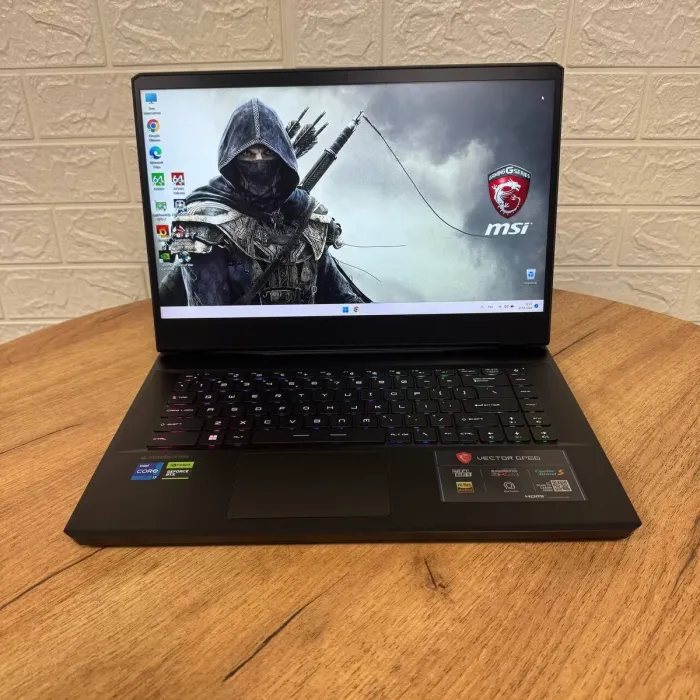 Ігровий ноутбук Б-клас MSI Vector GP66 12UHSO / 15.6" (1920x1080) IPS / Intel Core i7-12650H (10 (16) ядер по 3.5 - 4.7 GHz) / 16 GB DDR5 / 1000 GB SSD NVMe / nVidia GeForce RTX 3080 Ti, 16 GB GDDR6, 256-bit / WebCam б/в - зображення 2