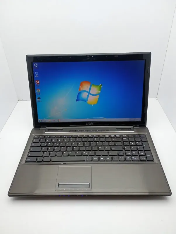 Ноутбук MSI CX61 / 15.6" (1366x768) TN / Intel Core i3-4000M (2 (4) ядра по 2.4 GHz) / 6 GB DDR3 / 500 GB HDD / Intel HD Graphic 4600 / WebCam б/в - зображення 2