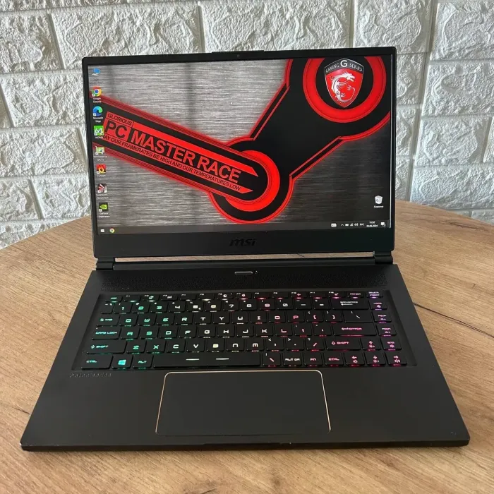 Ігровий ноутбук Б-клас MSI GS65 Stealth 8SF / 15.6" (1920x1080) IPS / Intel Core i7-8750H (6 (12) ядер по 2.2 - 4.1 GHz) / 32 GB DDR4 / 512 GB SSD / nVidia GeForce RTX 2060, 6 GB GDDR6, 192-bit / WebCam б/в - зображення 2