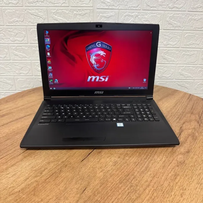Ігровий ноутбук Б-клас MSI GL62M 7REX / 15.6" (1920x1080) TN / Intel Core i7-7700HQ (4 (8) ядра по 2.8 - 3.8 GHz) / 16 GB DDR4 / 256 GB SSD M.2 + 1000 GB HDD / nVidia GeForce GTX 1050 Ti, 4 GB GDDR5, 128-bit / WebCam б/в - зображення 2