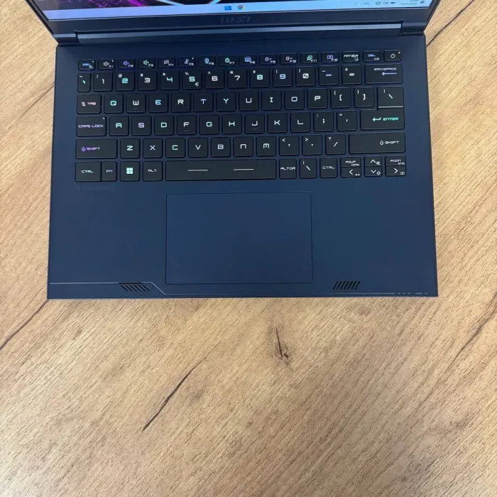 Ігровий ноутбук Б-клас MSI Stealth 14 Studio A13VF / 14" (1920x1200) IPS / Intel Core i7-13620H (10 (16) ядер по 3.6 - 4.9 GHz) / 16 GB DDR5 / 1000 GB SSD / nVidia GeForce RTX 4060, 8 GB GDDR6, 128-bit / WebCam б/в - зображення 8