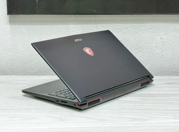 Ігровий ноутбук MSI MegaBook GP62 / 15.6" (1920x1080) TN / Intel Core i7-7700HQ (4 (8) ядра по 2.8 - 3.8 GHz) / 16 GB DDR4 / 128 GB SSD + 1000 GB HDD / nVidia GeForce GTX 1060, 3 GB GDDR5, 192-bit / WebCam б/в - зображення 6