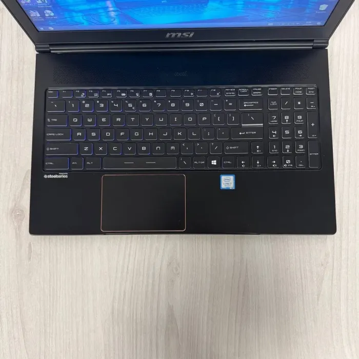 Ігровий ноутбук Б-клас MSI GS63VR 7RF Stealth Pro / 15.6" (1920x1080) TN / Intel Core i7-7700HQ (4 (8) ядра по 2.8 - 3.8 GHz) / 16 GB DDR4 / 256 GB SSD M.2 / nVidia GeForce GTX 1060, 6 GB GDDR5, 192-bit / WebCam б/в - зображення 7