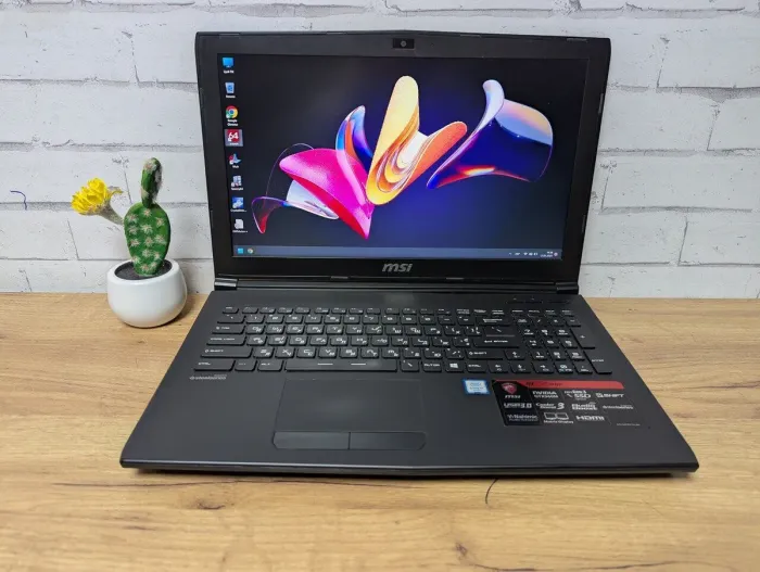 Ігровий ноутбук Б-клас MSI GP62 6QE MS-16J5 / 15.6" (1920x1080) TN / Intel Core i7-6700HQ (4 (8) ядра по 2.6 - 3.5 GHz) / 16 GB DDR4 / 256 GB SSD + 1000 GB HDD / nVidia GeForce GTX 960M, 4 GB GDDR5, 128-bit / WebCam / DVD-ROM б/в - зображення 2