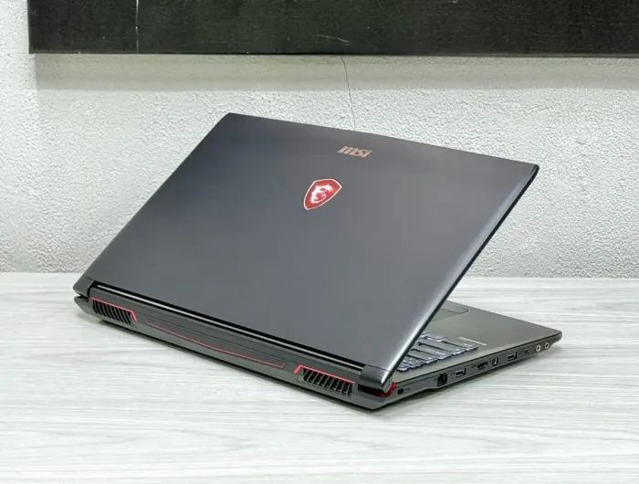 Ігровий ноутбук MSI GP62 / 15.6" (1920x1080) TN / Intel Core i7-7700HQ (4 (8) ядра по 2.8 - 3.8 GHz) / 16 GB DDR4 / 128 GB SSD M.2 + 1000 GB HDD / nVidia GeForce GTX 1060, 3 GB GDDR5, 192-bit / WebCam / Win 11 б/в - зображення 5