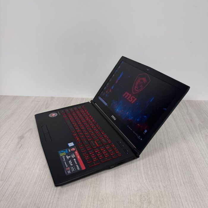 Ігровий ноутбук Б-класу MSI GL62M 7REX / 15,6" (1920x1080) TN / Intel Core i7-7700HQ (4 (8) ядра по 2,8 - 3,8 ГГц) / 16 ГБ DDR4 / 128 ГБ SSD NVMe + 1000 ГБ HDD / nVidia GeForce GTX 1050 Ti, 4 ГБ GDDR5, 128-біт / Веб-камера б/в - зображення 5