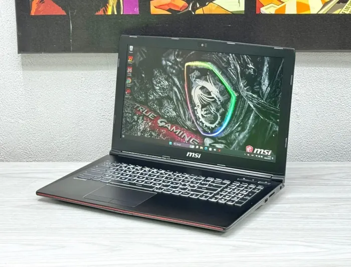 Ігровий ноутбук MSI GP62 / 15.6" (1920x1080) TN / Intel Core i7-7700HQ (4 (8) ядра по 2.8 - 3.8 GHz) / 16 GB DDR4 / 128 GB SSD M.2 + 1000 GB HDD / nVidia GeForce GTX 1060, 3 GB GDDR5, 192-bit / WebCam / Win 11 б/в - зображення 4