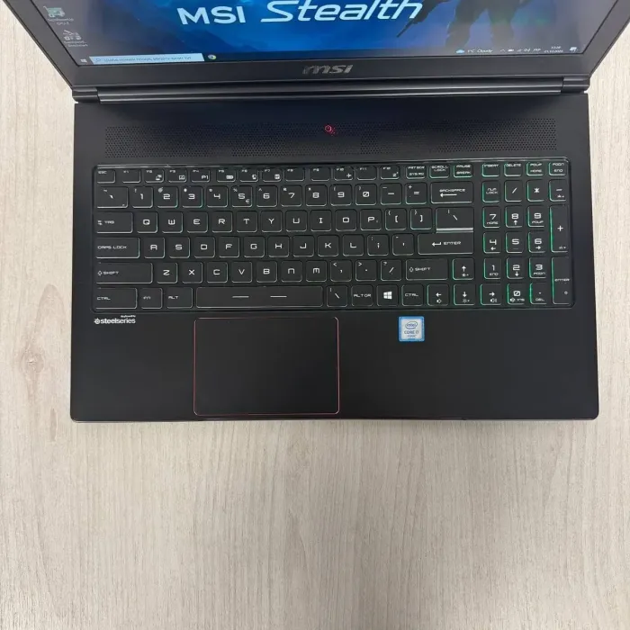 Ігровий ноутбук Б-класу MSI GS63VR Stealth 6RF / 15.6" (1920x1080) IPS / Intel Core i7-6700HQ (4 (8) ядра по 2.6 - 3.5 GHz) / 16 GB DDR4 / 512 GB SSD / nVidia GeForce GTX 1060, 6 GB GDDR5, 192-bit / WebCam б/в - изображение 3