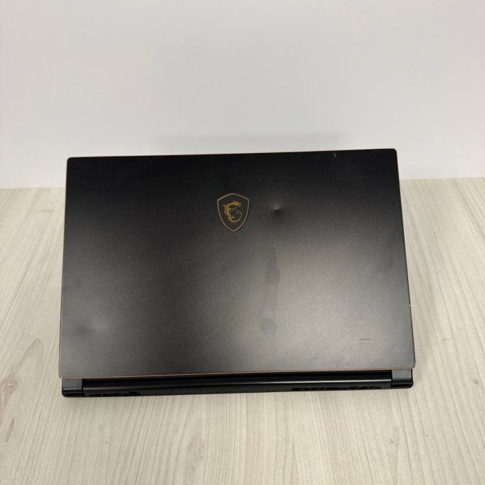 Ігровий ноутбук Б-клас MSI GS65 Stealth 9SE / 15.6" (1920x1080) IPS / Intel Core i7-9750H (6 (12) ядер по 2.6 - 4.5 GHz) / 16 GB DDR4 / 512 GB SSD NVMe / nVidia GeForce RTX 2060, 6 GB GDDR6, 192-bit / WebCam б/в - зображення 3