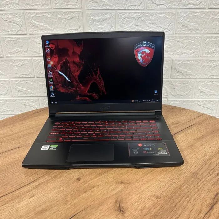 Ігровий ноутбук Б-клас MSI GF65 Thin 10SDR / 15.6" (1920x1080) IPS / Intel Core i7-10750H (6 (12) ядер по 2.6 - 5.0 GHz) / 16 GB DDR4 / 512 GB SSD / nVidia GeForce GTX 1660 Ti, 6 GB GDDR6, 192-bit / WebCam б/в - зображення 2