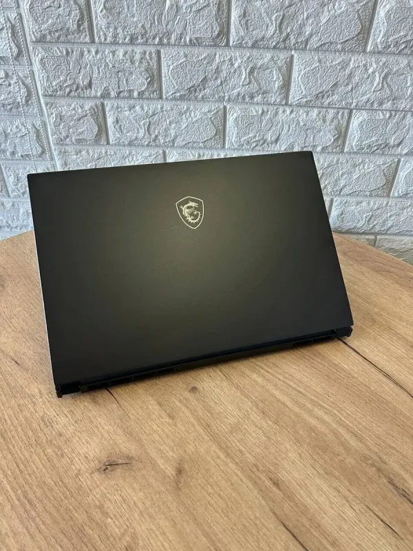 Ігровий ноутбук Б-клас MSI GS66 Stealth 11UE / 15.6" (1920x1080) IPS / Intel Core i7-11800H (8 (16) ядер по 2.3 - 4.6 GHz) / 16 GB DDR4 / 1000 GB SSD / nVidia GeForce RTX 3060, 6 GB GDDR6, 192-bit / WebCam б/в - зображення 3