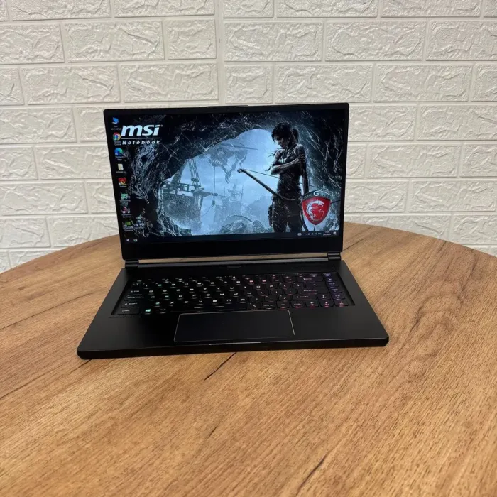 Ігровий ноутбук Б-клас MSI GS65 Stealth 9SF / 15.6" (1920x1080) IPS / Intel Core i7-9750H (6 (12) ядер по 2.6 - 4.5 GHz) / 16 GB DDR4 / 512 GB SSD NVMe / nVidia GeForce RTX 2070 Max-Q, 8 GB GDDR6, 256-bit / WebCam б/в - зображення 2