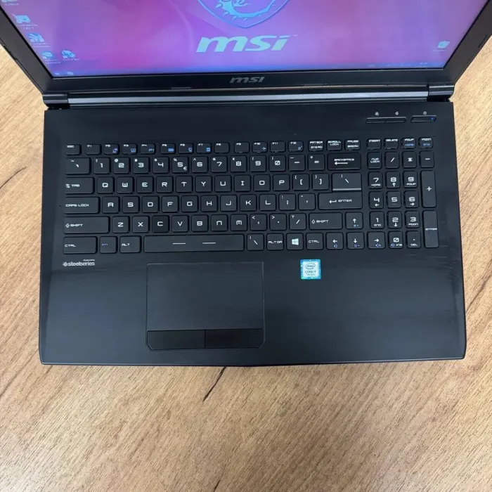 Ігровий ноутбук Б-клас MSI GL62M 7REX / 15.6" (1920x1080) TN / Intel Core i7-7700HQ (4 (8) ядра по 2.8 - 3.8 GHz) / 16 GB DDR4 / 256 GB SSD M.2 + 1000 GB HDD / nVidia GeForce GTX 1050 Ti, 4 GB GDDR5, 128-bit / WebCam б/в - зображення 7