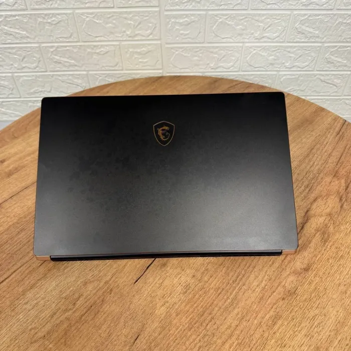 Ігровий ноутбук MSI GS75 Stealth 9SG / 17.3" (1920x1080) IPS / Intel Core i7-9750H (6 (12) ядер по 2.6 - 4.5 GHz) / 16 GB DDR4 / 256 GB SSD / nVidia GeForce RTX 2080 Max-Q, 8 GB GDDR6, 256-bit / WebCam б/в - зображення 3