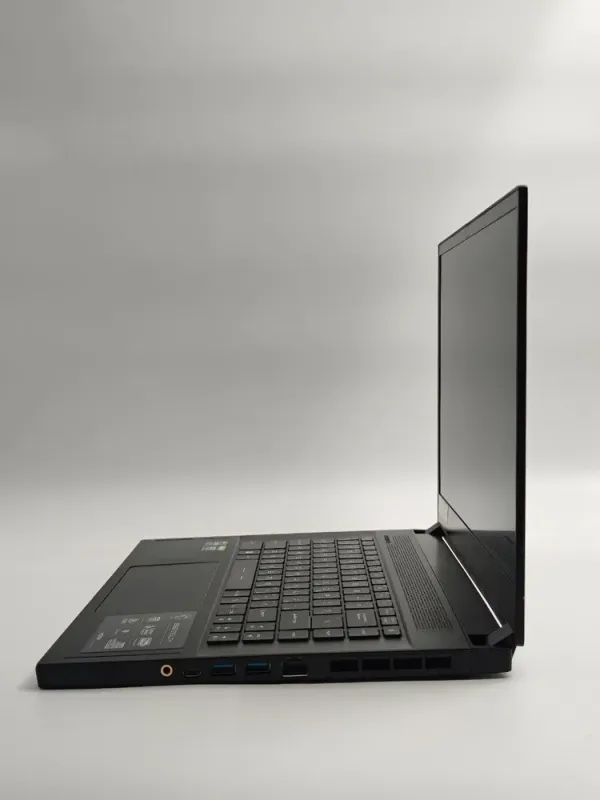 Ігровий ноутбук Б-класу MSI GS66 Stealth 11UH / 15,6" (1920x1080) IPS / Intel Core i9-11900H (8 (16) ядер по 2,1 - 4,9 ГГц) / 32 ГБ DDR4 / 256 ГБ SSD+256 ГБ SSD / nVidia GeForce RTX 3080, 16 ГБ GDDR6, 256-біт / WebCam б/в - зображення 4