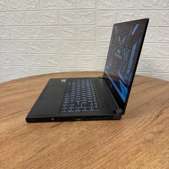 Мобільна робоча станція Б-клас MSI WS66 10TKT / 15.6" (1920x1080) IPS Touch / Intel Core i7-10875H (8 (16) ядер по 2.3 - 5.1 GHz) / 32 GB DDR4 / 1000 GB SSD / nVidia Quadro RTX 3000, 6 GB GDDR6, 192-bit / WebCam б/в - зображення 5