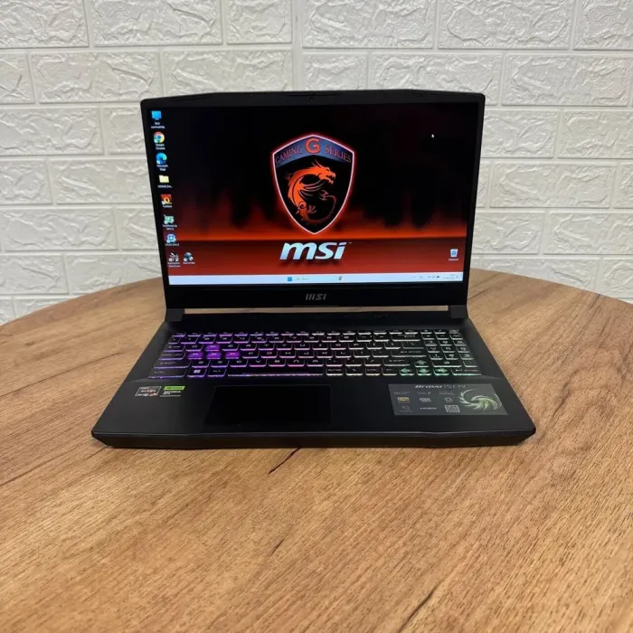 Ігровий ноутбук MSI Bravo 15 C7VFK / 15.6" (1920x1080) IPS / AMD Ryzen 7 7735HS (8 (16) ядер по 3.2 - 4.75 GHz) / 16 GB DDR5 / 1000 GB SSD NVMe / nVidia GeForce RTX 4060, 8 GB GDDR6, 128-bit / WebCam б/в - зображення 2