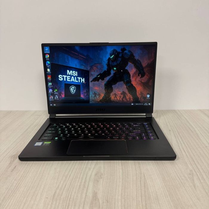 Ігровий ноутбук Б-клас MSI GS65 Stealth 9SE / 15.6" (1920x1080) IPS / Intel Core i7-9750H (6 (12) ядер по 2.6 - 4.5 GHz) / 16 GB DDR4 / 512 GB SSD NVMe / nVidia GeForce RTX 2060, 6 GB GDDR6, 192-bit / WebCam б/в - зображення 2
