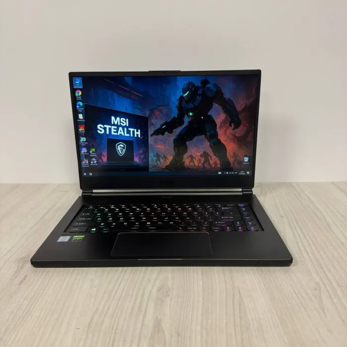Ігровий ноутбук Б-клас MSI GS65 Stealth 9SE / 15.6" (1920x1080) IPS / Intel Core i7-9750H (6 (12) ядер по 2.6 - 4.5 GHz) / 16 GB DDR4 / 512 GB SSD NVMe / nVidia GeForce RTX 2060, 6 GB GDDR6, 192-bit / WebCam б/в - зображення 2