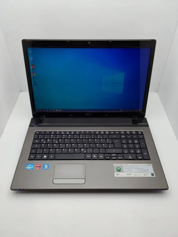 Ноутбук Acer Aspire 7750G / 17.3" (1600x900) TN / Intel Core i7-2630QM (4 (8) ядра по 2.0 - 2.9 GHz) / 6 GB DDR3 / 120 GB SSD + 750 GB HDD / AMD Radeon HD 6770M, 2 GB GDDR5, 128-bit / WebCam / DVD-ROM б/в - зображення 2