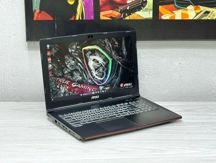 Ігровий ноутбук MSI MegaBook GP62 / 15.6" (1920x1080) TN / Intel Core i7-7700HQ (4 (8) ядра по 2.8 - 3.8 GHz) / 16 GB DDR4 / 128 GB SSD + 1000 GB HDD / nVidia GeForce GTX 1060, 3 GB GDDR5, 192-bit / WebCam б/в - зображення 3